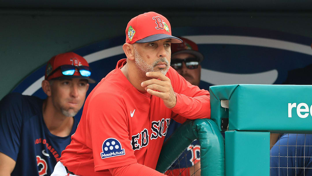 Feb 22, 2026; Fort Myers, Florida, USA; Boston Red Sox manager Alex Cora (13) looks on from the dugout during the third inning against the Toronto Blue Jays  at JetBlue Park at Fenway South. Mandatory Credit: Kim Klement Neitzel-Imagn Images