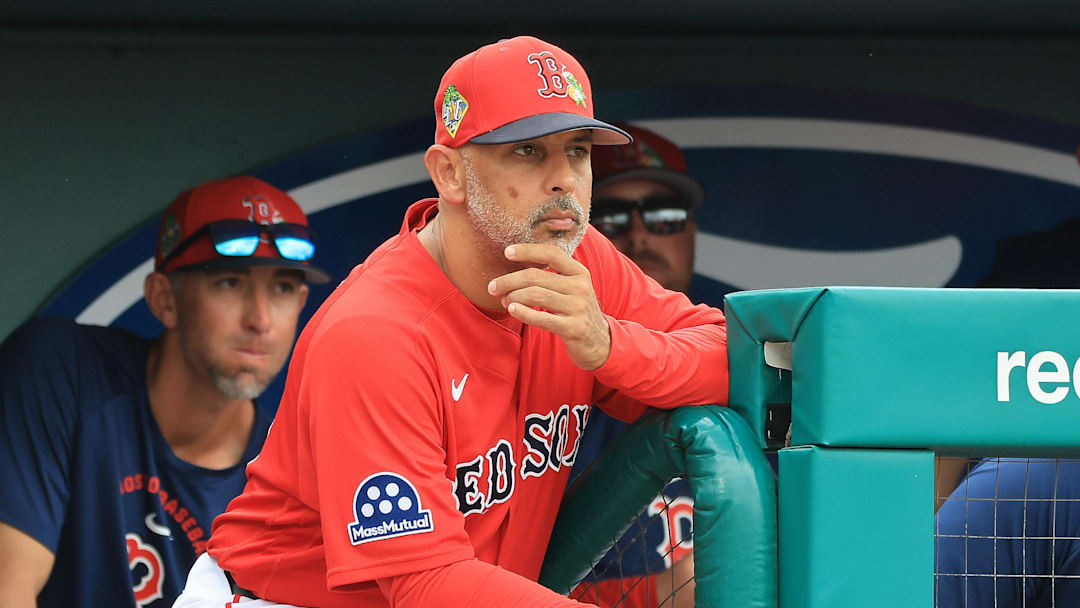 Feb 22, 2026; Fort Myers, Florida, USA; Boston Red Sox manager Alex Cora (13) looks on from the dugout during the third inning against the Toronto Blue Jays at JetBlue Park at Fenway South. Mandatory Credit: Kim Klement Neitzel-Imagn Images Feb 22, 2026; Fort Myers, Florida, USA; Boston Red Sox manager Alex Cora (13) looks on from the dugout during the third inning against the Toronto Blue Jays at JetBlue Park at Fenway South. Mandatory Credit: Kim Klement Neitzel-Imagn Images