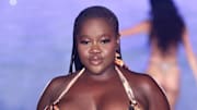 Achieng Agutu walks the runway for the Sports Illustrated Swimsuit Runway Show