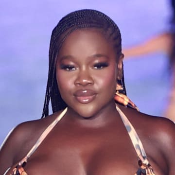 Achieng Agutu walks the runway for the Sports Illustrated Swimsuit Runway Show