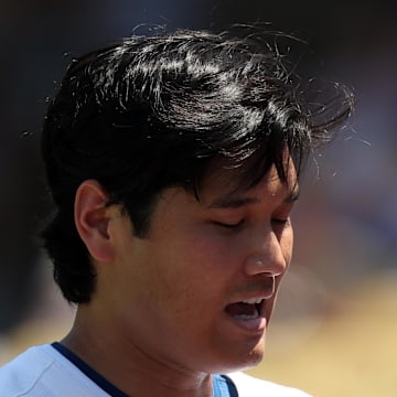 Los Angeles Dodgers two-way player Shohei Ohtani (17) is being checked an umpire after pitching in the fourth inning against the St. Louis Cardinals at Dodger Stadium on Aug. 6. 