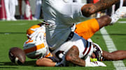 Mississippi State Bulldogs running back Davon Booth (6) takes a hard hit from Tennessee Volunteers defensive back Boo Carter (23) during the first half at Davis Wade Stadium at Scott Field. 