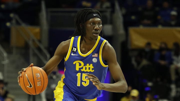 Feb 22, 2022; Pittsburgh, Pennsylvania, USA; Pittsburgh Panthers forward Mouhamadou Gueye (15) dribbles the ball against the Miami (Fl) Hurricanes during the first half at the Petersen Events Center. Mandatory Credit: Charles LeClaire-USA TODAY Sports