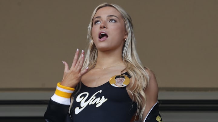 May 11, 2024; Pittsburgh, Pennsylvania, USA; Louisiana State University gymnast Olivia Dunn (middle) reacts as her boyfriend Pittsburgh Pirates starting pitcher Paul Skenes (not pictured) pitches in his major league debut against the Chicago Cubs during the fourth inning at PNC Park. Mandatory Credit: Charles LeClaire-Imagn Images May 11, 2024; Pittsburgh, Pennsylvania, USA; Louisiana State University gymnast Olivia Dunn (middle) reacts as her boyfriend Pittsburgh Pirates starting pitcher Paul Skenes (not pictured) pitches in his major league debut against the Chicago Cubs during the fourth inning at PNC Park. Mandatory Credit: Charles LeClaire-Imagn Images
