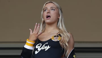 May 11, 2024; Pittsburgh, Pennsylvania, USA;  Louisiana State University gymnast Olivia Dunn (middle) reacts as her boyfriend Pittsburgh Pirates starting pitcher Paul Skenes (not pictured) pitches in his major league debut against the Chicago Cubs during the fourth inning at PNC Park. Mandatory Credit: Charles LeClaire-Imagn Images
