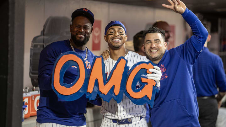 Aug 14, 2024; New York City, New York, USA;  New York Mets shortstop Francisco Lindor (12) celebrates in the dugout after hitting a solo home run in the third inning against the Oakland Athletics at Citi Field. Mandatory Credit: Wendell Cruz-USA TODAY Sports