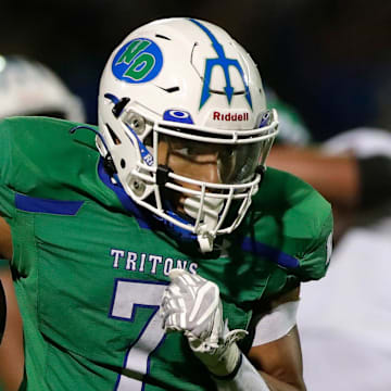 Notre Dame Academy's Kingston Allen (7) runs the ball in for a touchdown during a football game against De Pere High School on Aug. 29, 2025.