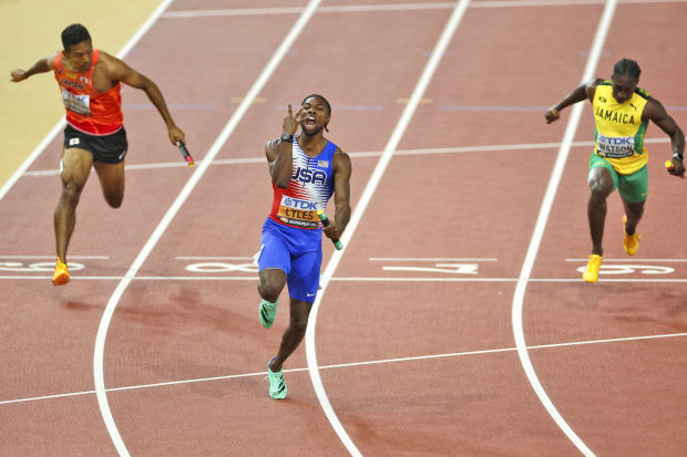 Noah Lyles celebrates after crossing the finish line of the 4x100 relay to win gold at the 2023 World Championships.