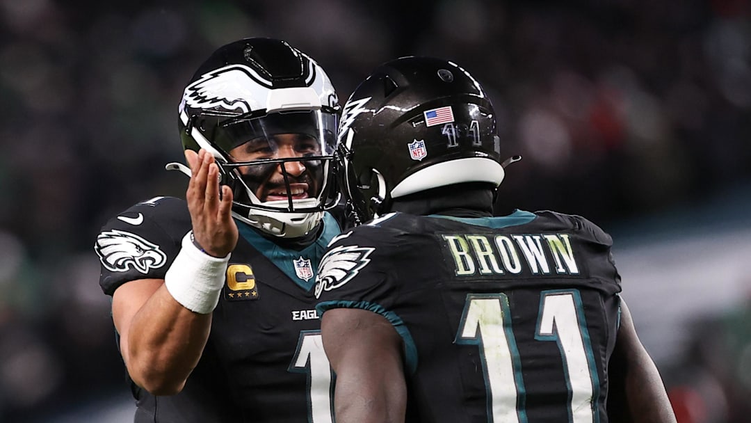 Nov 28, 2025; Philadelphia, Pennsylvania, USA; Philadelphia Eagles quarterback Jalen Hurts (1) and wide receiver A.J. Brown (11) celebrate a touchdown against the Chicago Bears during the third quarter of the game at Lincoln Financial Field. Mandatory Credit: Bill Streicher-Imagn Images