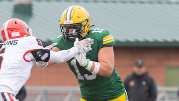 Howell's Jackson Pahl (13) makes a block on East Kentwood's Donavan Jones Saturday, Nov. 8, 2025.