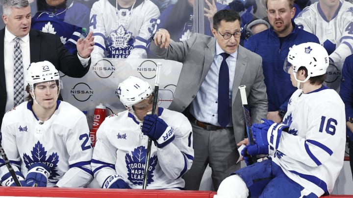 Jan 27, 2024; Winnipeg, Manitoba, CAN; Toronto Maple Leafs head coach Sheldon Keefe and assistant coach Guy Boucher discuss a play with Toronto Maple Leafs right wing Mitchell Marner (16) in the third period against the Winnipeg Jets at Canada Life Centre. Mandatory Credit: James Carey Lauder-USA TODAY Sports