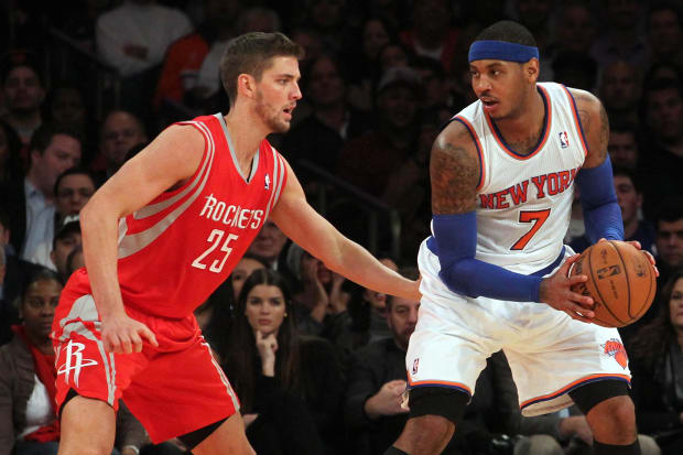Nov 14, 2013; New York, NY, USA; New York Knicks small forward Carmelo Anthony (7) controls the ball against Houston Rockets small forward Chandler Parsons (25) during the second quarter of a game at Madison Square Garden. Mandatory Credit: Brad Penner-USA TODAY Sports