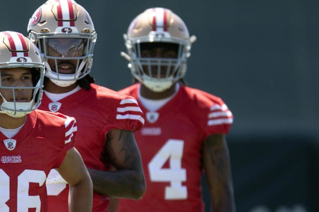 San Francisco 49ers wide receivers Jacob Cowing (19), Junior Bergen (86), Malik Knowles (3) and Isaiah Neyor (14) queue up.