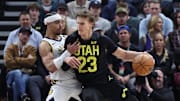 Jan 15, 2024; Salt Lake City, Utah, USA; Utah Jazz forward Lauri Markkanen (23) dribbles against Indiana Pacers guard Andrew Nembhard (2) during the first quarter at Delta Center. Mandatory Credit: Rob Gray-Imagn Images