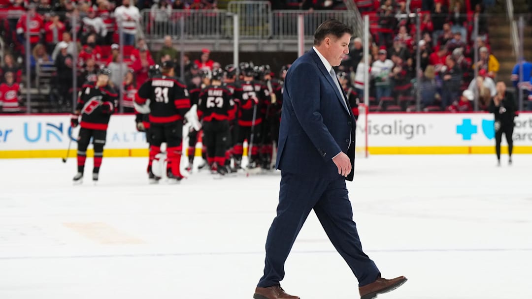 Apr 12, 2025; Raleigh, North Carolina, USA;  New York Rangers head coach Peter Laviolette walks off the ice after their loss to the Carolina Hurricanes at Lenovo Center. Mandatory Credit: James Guillory-Imagn Images