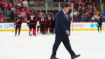 Apr 12, 2025; Raleigh, North Carolina, USA;  New York Rangers head coach Peter Laviolette walks off the ice after their loss to the Carolina Hurricanes at Lenovo Center. Mandatory Credit: James Guillory-Imagn Images
