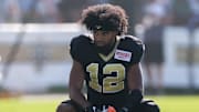 Jul 28, 2025; Metairie, LA, USA;  New Orleans Saints wide receiver Chris Olave (12) looks on during training camp at Ochsner Sports Performance Center. Mandatory Credit: Stephen Lew-Imagn Images