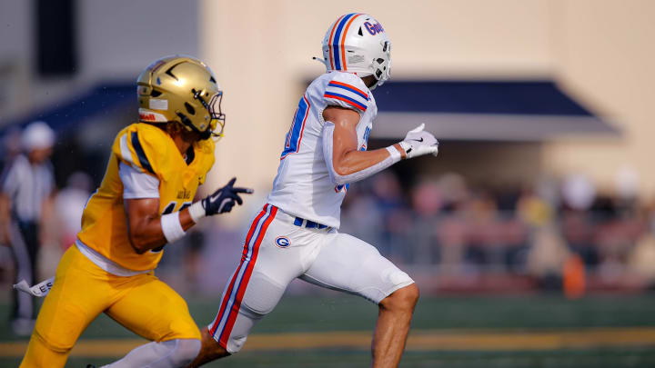 Bishop Gorman outscored St. Thomas Aquinas 12-0 in the fourth quarter and turned back a last minute Aquinas drive to secure a 29-21 victory in a battle of two Top 10 nationally ranked high school football teams, Saturday in South Florida.