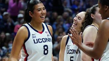 UConn Huskies center Jana El Alfy reacts with guard Paige Bueckers after a basket against the USF Bulls.