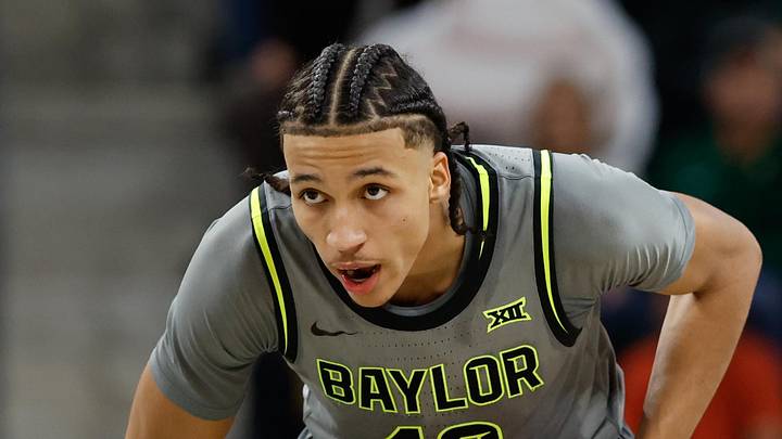 Jan 7, 2026; Waco, Texas, USA;  Baylor Bears guard Cameron Carr (43) controls the ball as Iowa State Cyclones guard Killyan Toure (27) defends during the second half at Paul and Alejandra Foster Pavilion. Mandatory Credit: Chris Jones-Imagn Images