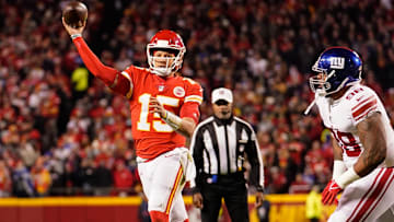 Nov 1, 2021; Kansas City, Missouri, USA; Kansas City Chiefs quarterback Patrick Mahomes (15) throws a pass as New York Giants nose tackle Austin Johnson (98) defends during the first half at GEHA Field at Arrowhead Stadium. Mandatory Credit: Jay Biggerstaff-Imagn Images