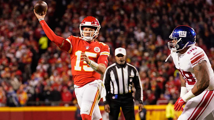 Nov 1, 2021; Kansas City, Missouri, USA; Kansas City Chiefs quarterback Patrick Mahomes (15) throws a pass as New York Giants nose tackle Austin Johnson (98) defends during the first half at GEHA Field at Arrowhead Stadium. Mandatory Credit: Jay Biggerstaff-Imagn Images