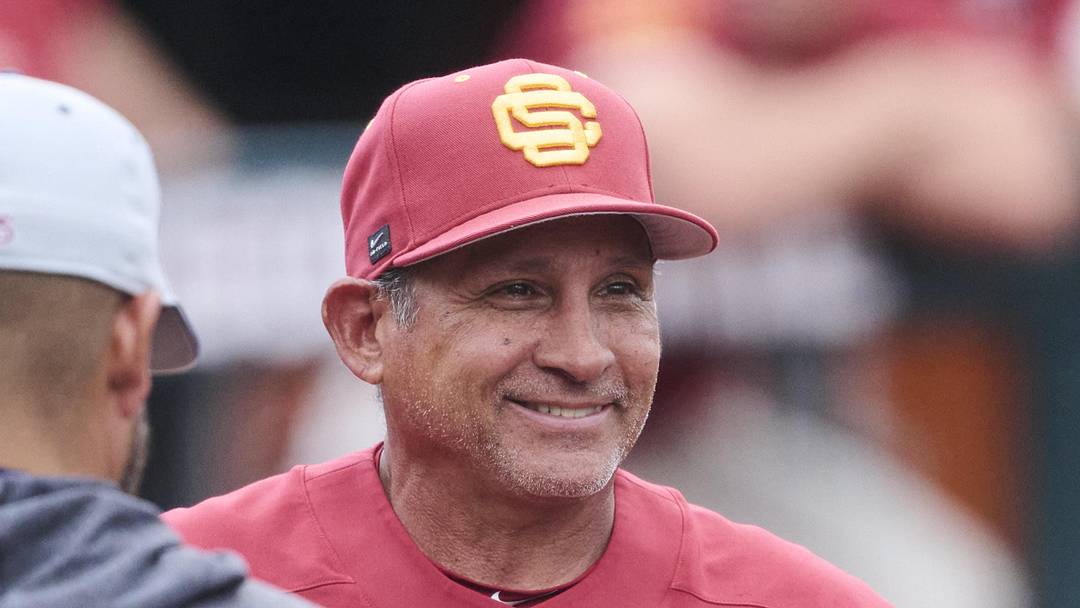 May 31, 2025; Corvallis, OR, USA; USC head coach Andy Stankiewicz visits with official before a game against Saint Mary's at the NCAA Corvallis Regional at Goss Stadium. Mandatory Credit: Troy Wayrynen-Imagn Images
