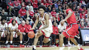 Oct 17, 2024; Piscataway, NJ, USA;  Rutgers Scarlet Knights guard Dylan Harper (2) looks to drive past St. John's Red Storm guard Simeon Wilcher (7) in the second half at Jersey Mike's Arena. Mandatory Credit: Wendell Cruz-Imagn Images