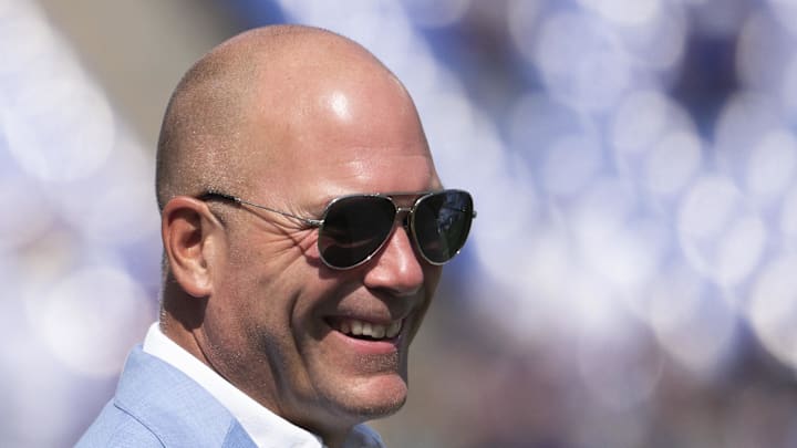 Sep 15, 2024; Baltimore, Maryland, USA;  Baltimore Ravens general manager Eric DeCosta walks across the the field before the game against the Las Vegas Raiders at M&T Bank Stadium. Mandatory Credit: Tommy Gilligan-Imagn Images