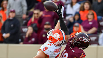 Nov 9, 2024; Blacksburg, Virginia, USA;  Virginia Tech Hokies safety Mose Phillips III (18) breaks up a pass intended for Clemson Tigers tight end Jake Briningstool (9) during the second quarter at Lane Stadium. Mandatory Credit: Brian Bishop-Imagn Images