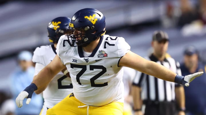 Dec 28, 2021; Phoenix, AZ, USA; West Virginia Mountaineers offensive lineman Doug Nester (72) against the Minnesota Golden Gophers in the Guaranteed Rate Bowl at Chase Field.