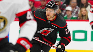 Dec 13, 2024; Raleigh, North Carolina, USA; Carolina Hurricanes center Tyson Jost (27) skates against the Ottawa Senators during the first period at Lenovo Center. Mandatory Credit: James Guillory-Imagn Images