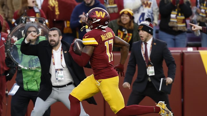 Nov 24, 2024; Landover, Maryland, USA; Washington Commanders wide receiver Terry McLaurin (17) scores a touchdown in the final minute of the fourth quarter against the Dallas Cowboys at Northwest Stadium. Mandatory Credit: Geoff Burke-Imagn Images