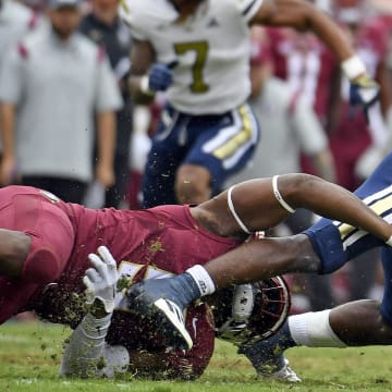 Oct 29, 2022; Tallahassee, Florida, USA; Georgia Tech Yellow Jackets running back Hassan Hall (3) is tackled by Florida State Seminoles defensive end Jared Verse (5) during the second half at Doak S. Campbell Stadium. Mandatory Credit: Melina Myers-USA TODAY Sports