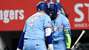 Texas Rangers designated hitter Joc Pederson (4) celebrates with Texas Rangers right fielder Adolis Garcia (53) after hitting a two-run home run during the first inning against the Philadelphia Phillies at Globe Life Field. 