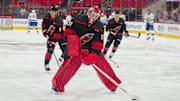 Oct 11, 2024; Raleigh, North Carolina, USA;  Carolina Hurricanes goaltender Frederik Andersen (31) skates with the puck during the warmups before the game against the Tampa Bay Lightning at PNC Arena. Mandatory Credit: James Guillory-Imagn Images
