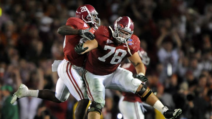 Jan 7, 2010, Pasadena, CA, USA; Alabama Crimson Tide defensive back Javier Arenas (28) and offensive lineman Mike Johnson (78) celebrate during the 2010 BCS National Championship against the Texas Longhorns at the Rose Bowl. Alabama defeated Texas 37-21. 