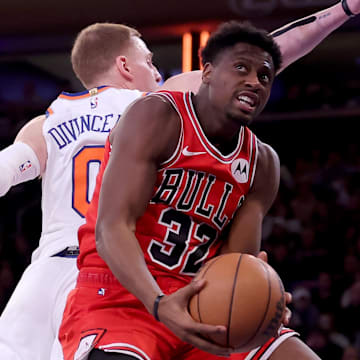 Jan 3, 2024; New York, New York, USA; Chicago Bulls forward Terry Taylor (32) drives to the basket against New York Knicks guard Donte DiVincenzo (0) during the third quarter at Madison Square Garden. Mandatory Credit: Brad Penner-Imagn Images