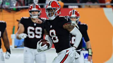 Dec 11, 2025; Tampa, Florida, USA; Atlanta Falcons tight end Kyle Pitts Sr. (8) runs with the ball after a catch against the Tampa Bay Buccaneers during the second quarter at Raymond James Stadium.