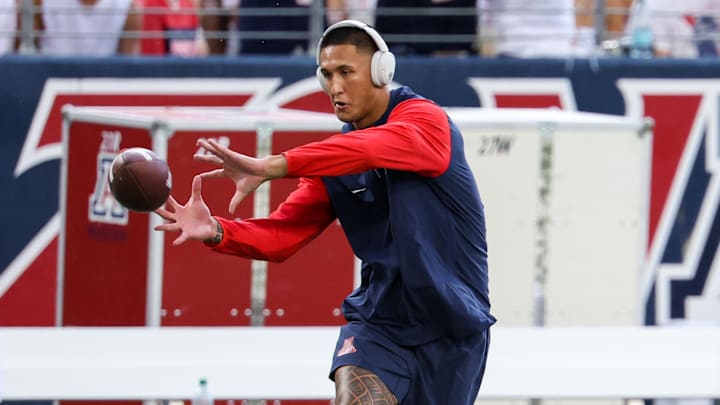 Aug 31, 2024; Tucson, Arizona, USA; Arizona Wildcats wide receiver Tetairoa McMillan (4) warms up before the game at Arizona Stadium. Mandatory Credit: Aryanna Frank-Imagn Images