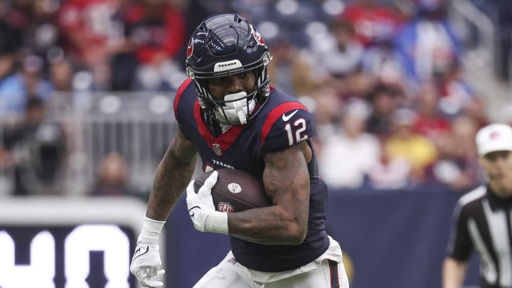 Dec 31, 2023; Houston, Texas, USA; Houston Texans wide receiver Nico Collins (12) in action during the game against the Tennessee Titans at NRG Stadium. Mandatory Credit: Troy Taormina-USA TODAY Sports