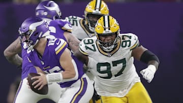 Dec 31, 2023; Minneapolis, Minnesota, USA; Green Bay Packers defensive tackle Kenny Clark (97) pressures Minnesota Vikings quarterback Jaren Hall (16) during their game at U.S. Bank Stadium. Mandatory Credit: Dan Powers-Imagn Images
