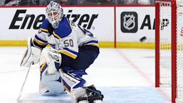 May 4, 2025; Winnipeg, Manitoba, CAN; St. Louis Blues goaltender Jordan Binnington (50) eyes the puck against the Winnipeg Jets in the second period in game seven of the first round of the 2025 Stanley Cup Playoffs at Canada Life Centre. Mandatory Credit: James Carey Lauder-Imagn Images