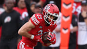 Utah Utes safety Jackson Bennee (23) intercepts a pass and returns it for a touchdown against the Cal Poly Mustangs during the first quarter at Rice-Eccles Stadium.