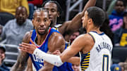 Dec 18, 2023; Indianapolis, Indiana, USA; LA Clippers forward Kawhi Leonard (2) looks to pass the ball while Indiana Pacers guard Tyrese Haliburton (0) defends in the second half at Gainbridge Fieldhouse. Mandatory Credit: Trevor Ruszkowski-Imagn Images