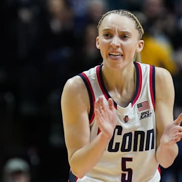 UConn guard Paige Bueckers cheers on her teammates during a game.