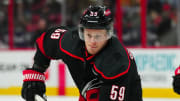 Mar 24, 2024; Raleigh, North Carolina, USA;  Carolina Hurricanes left wing Jake Guentzel (59) skates against the Toronto Maple Leafs during the first period at PNC Arena. Mandatory Credit: James Guillory-USA TODAY Sports