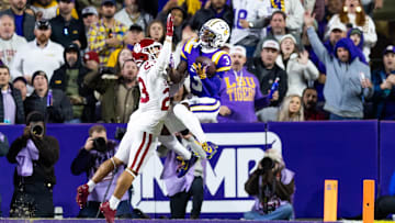 Nov 30, 2024; Baton Rouge, Louisiana, USA;  LSU Tigers wide receiver Chris Hilton Jr. (3) catches a touchdown against Oklahoma Sooners linebacker Danny Stutsman (28) during the second quarter at Tiger Stadium. Mandatory Credit: Stephen Lew-Imagn Images