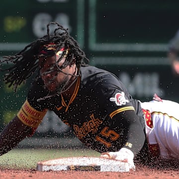 May 10, 2025; Pittsburgh, Pennsylvania, USA;  Pittsburgh Pirates center fielder Oneil Cruz (15) steals second base against the Atlanta Braves during the third inning at PNC Park. Mandatory Credit: Charles LeClaire-Imagn Images