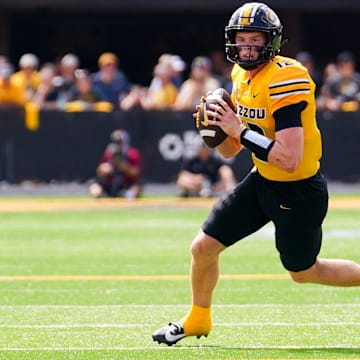 Sep 14, 2024; Columbia, Missouri, USA; Missouri Tigers quarterback Brady Cook (12) drops back to pass against the Boston College Eagles during the first half at Faurot Field at Memorial Stadium. Mandatory Credit: Denny Medley-Imagn Images